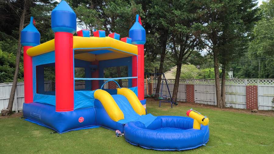 Bounce house with slide and pool